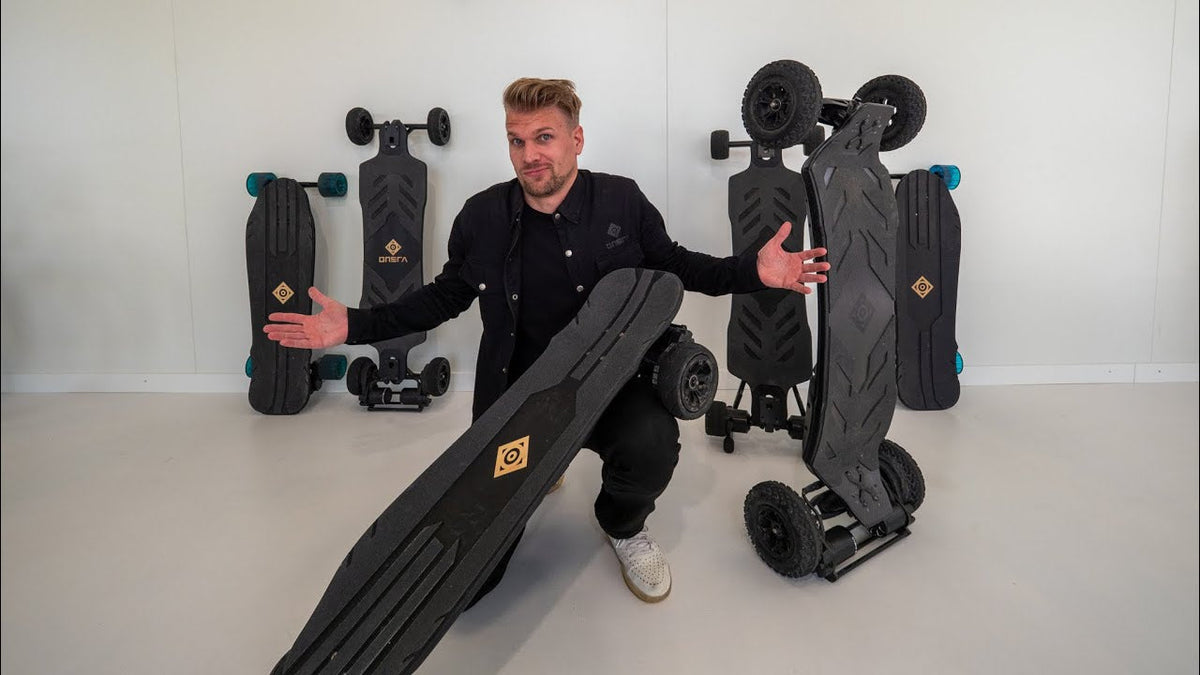 Presenting several ONSRA electric skateboards, street and all-terrain models, in a studio