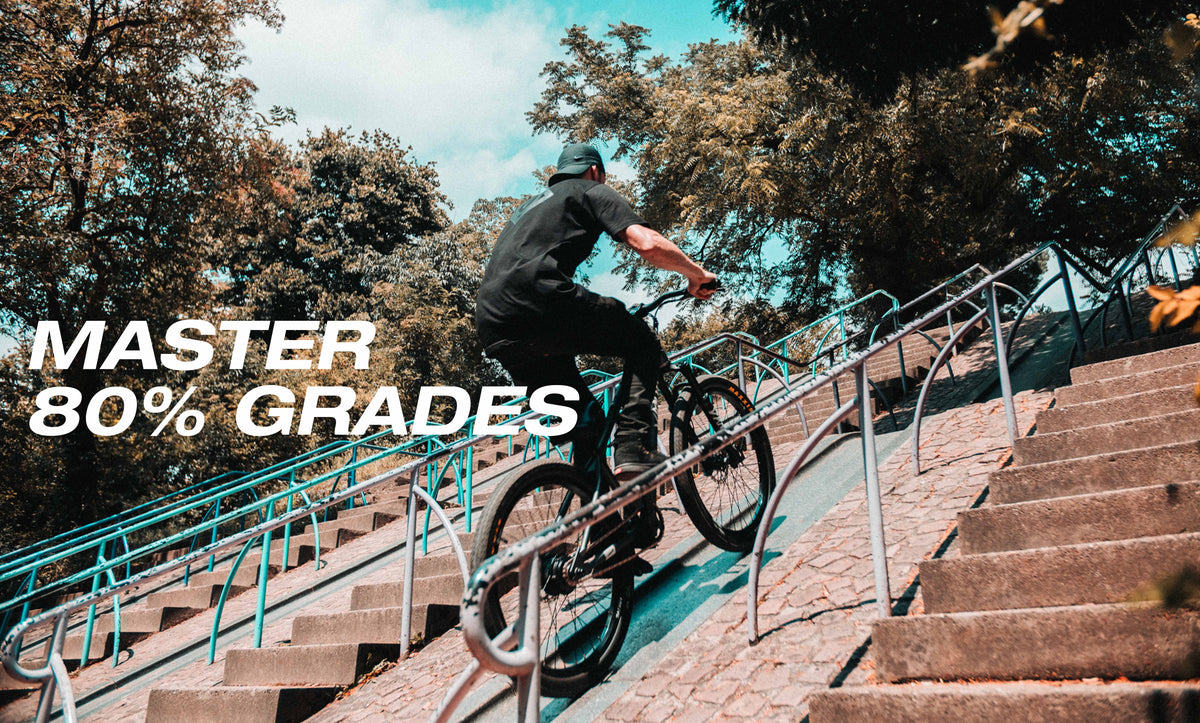 Rider on an ONSRA VANDAL electric bike riding down stairs – "Master 80% grades"
