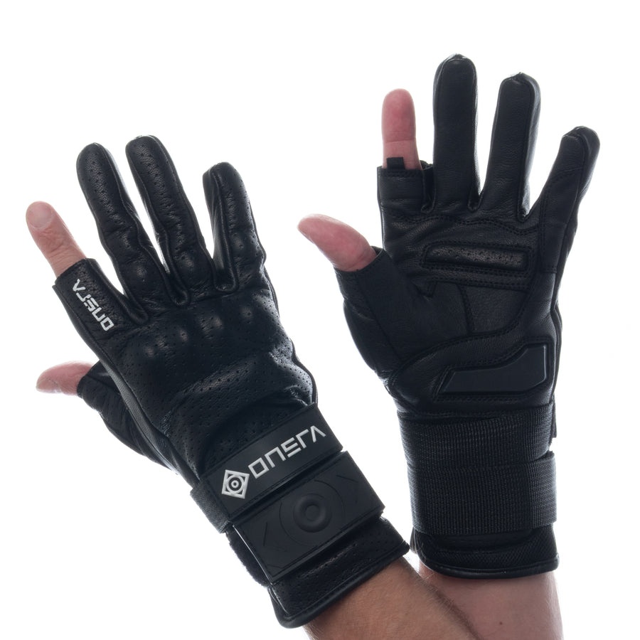 Pair of black ONSRA RACE leather e-skate gloves with wrist guards, worn on both hands