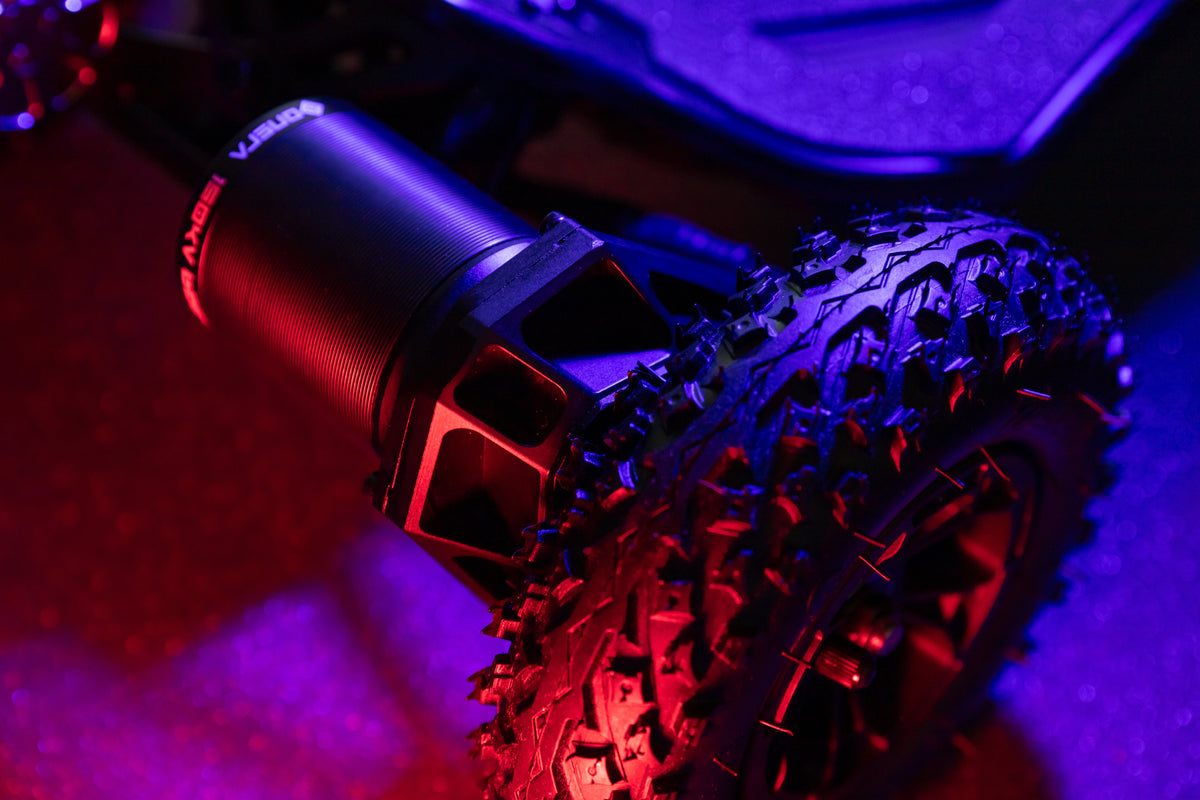 ONSRA VELAR all-terrain tire and truck in red and blue light
